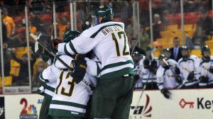 hockey players unite in group huddle as they win the kendall ice classic in 2011 westmark hotels