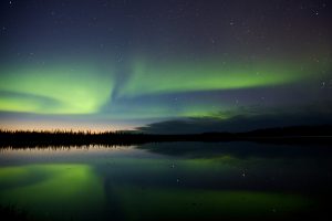 The northern lights over a lake in Alaska